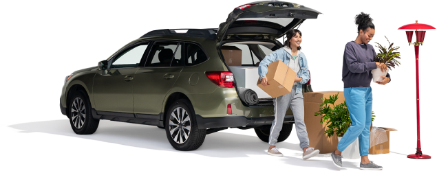 A mother and daughter unload plants and boxes from their SUV into their new home.